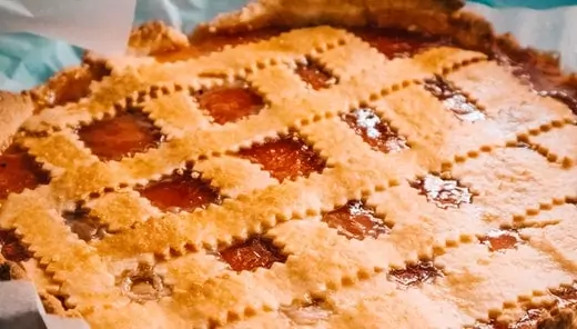 the picture shows an apple pie with lots of maple syrup in it.