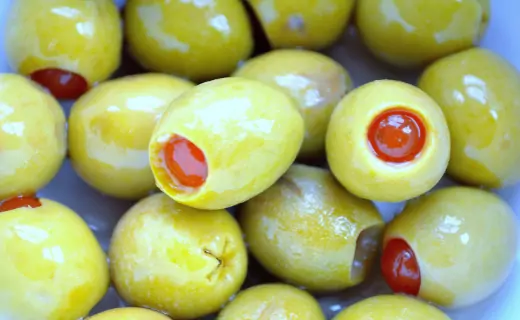 green olives with red seeds